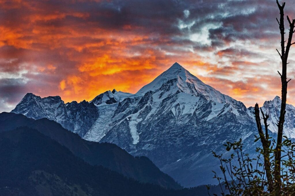 Sun setting behind the mountains in Munsiyari